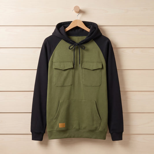 Men's green and black colour block quarter-zip hooded sweater hanging on a wooden hanger