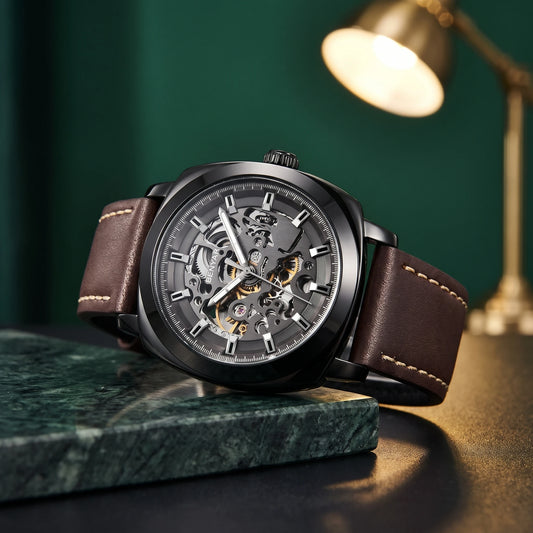 Men's black skeleton automatic watch with brown leather strap on green marble