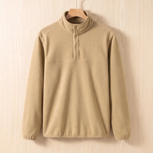 Khaki fleece pullover with a snap collar and elastic cuffs hanging on a wooden hanger