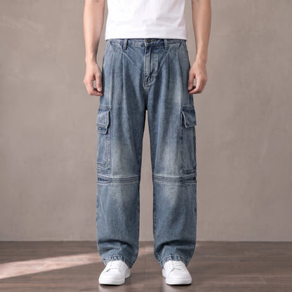 Mid blue washed baggy cargo jeans with big thigh pockets worn with a white tee and sneakers