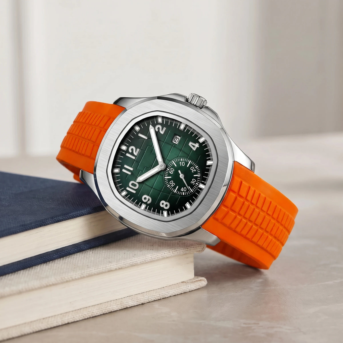 Orange strap sport watch on a book stack