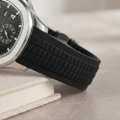 Close-up of the ribbed silicone strap and silver case