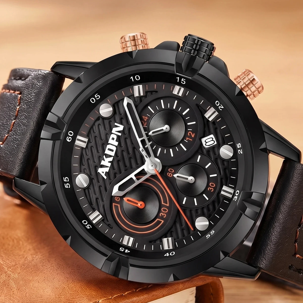 Close-up of the black dial, bezel numerals and rose-gold pushers on a sports watch