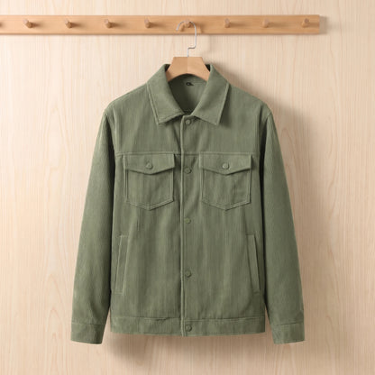 Men's green corduroy jacket hanging on a wooden hanger