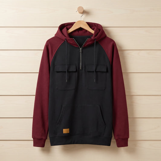 Men's black and wine colour block quarter-zip hooded sweater hanging on a wooden hanger