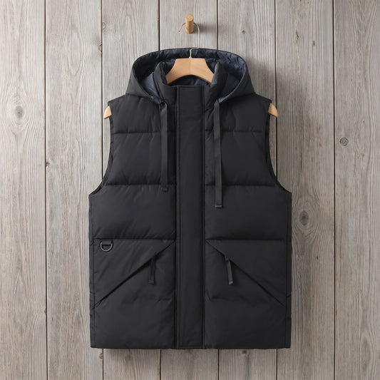 Black drawcord hooded vest on a grey wood wall