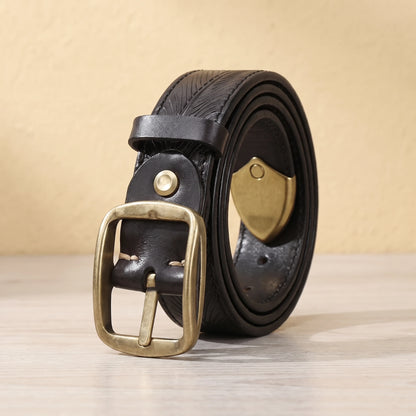 Black leather belt with feather pattern embossing, brass pin buckle and brass shield tip