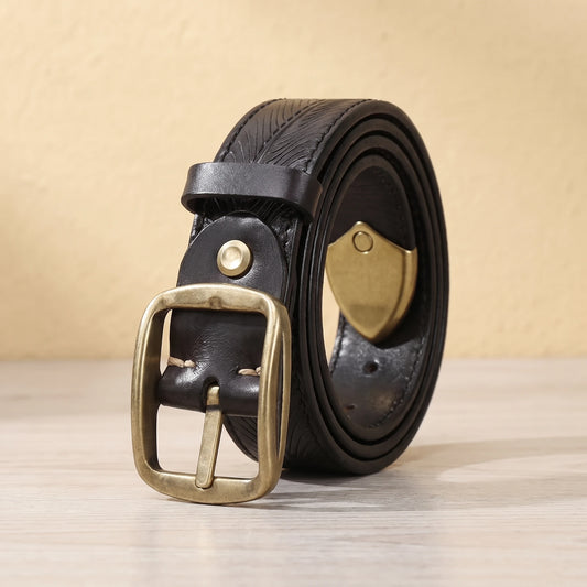 Black leather belt with feather pattern embossing, brass pin buckle and brass shield tip