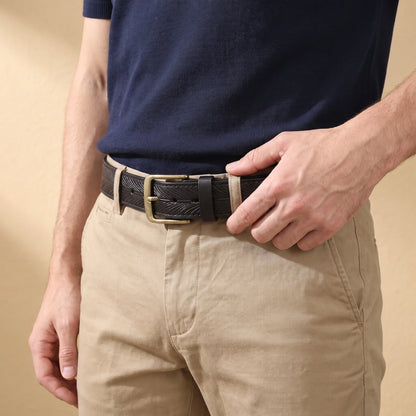 Man wearing the black feather embossed leather belt with khaki chinos and a navy polo