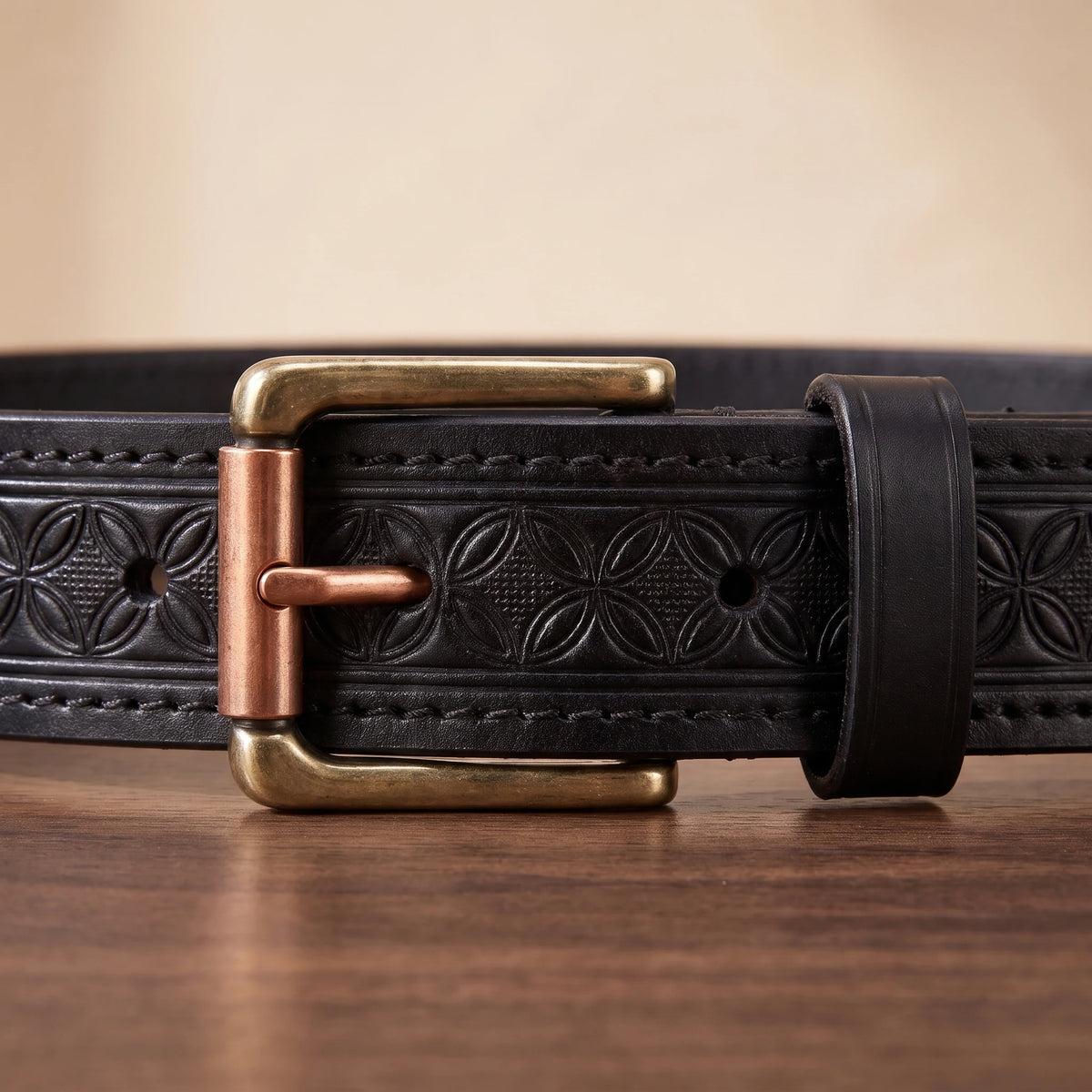 Close-up of the brass buckle with copper roller bar on the black belt