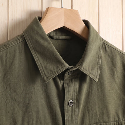 Close-up of the collar and buttons on a green thick cotton twill overshirt