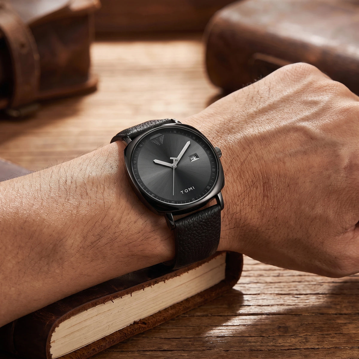 Man wearing the black leather strap quartz watch on his wrist