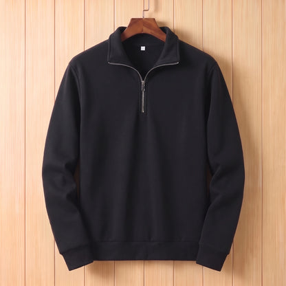 Black half zip sweater with a folded collar and ribbed cuffs hanging on a wooden hanger