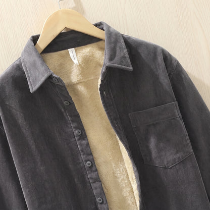 Close-up of the collar, buttons and cream fleece lining on a grey corduroy shirt