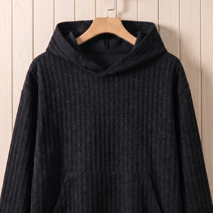 Close-up of the hood and front pocket on the black knit hooded sweater