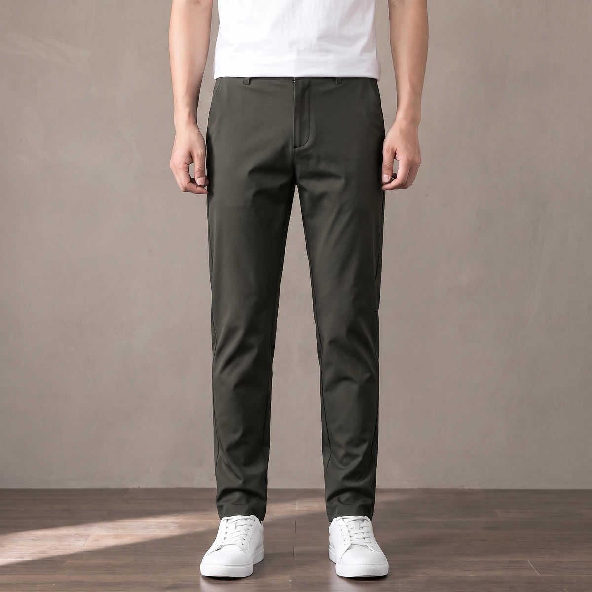 army green slim stretch trousers worn with a white tee and white trainers