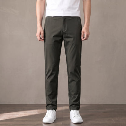 army green slim stretch trousers worn with a white tee and white trainers