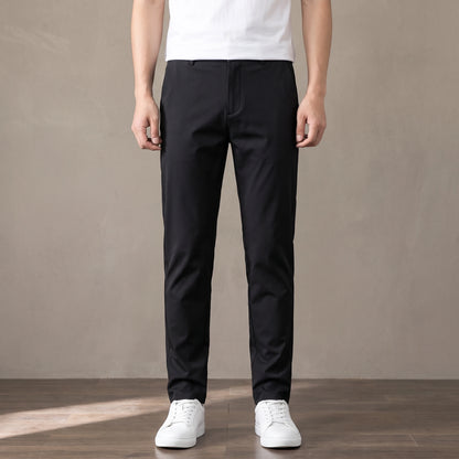 black slim stretch trousers worn with a white tee and white trainers