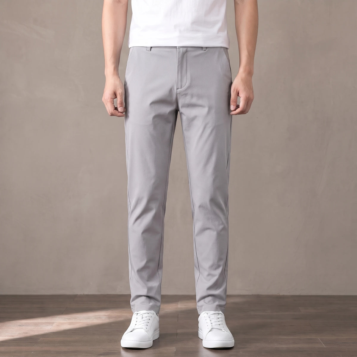 light grey slim stretch trousers worn with a white tee and white trainers