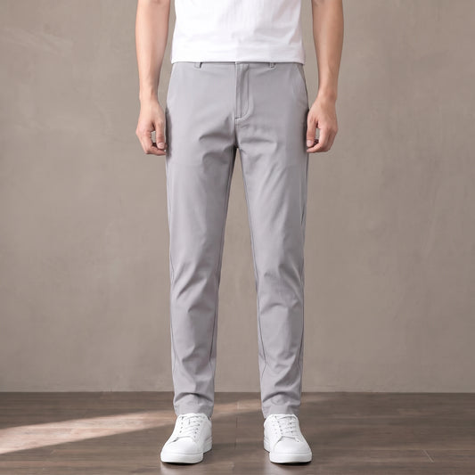 light grey slim stretch trousers worn with a white tee and white trainers