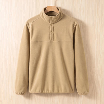 Khaki fleece pullover with a snap collar and elastic cuffs hanging on a wooden hanger