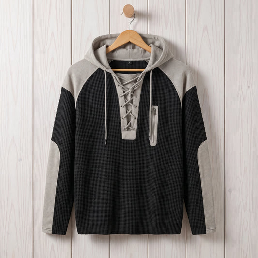 Men's black waffle knit lace-up hooded sweater hanging on a wooden hanger