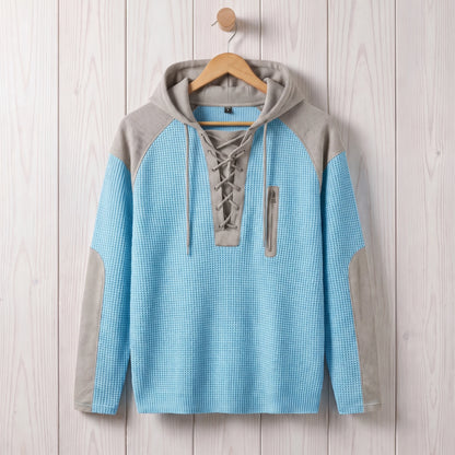 Men's light blue waffle knit lace-up hooded sweater hanging on a wooden hanger