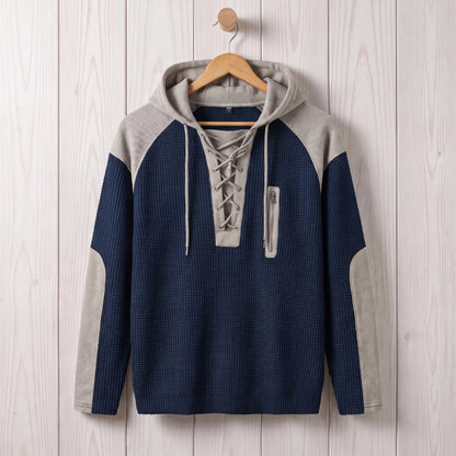 Men's navy blue waffle knit lace-up hooded sweater hanging on a wooden hanger