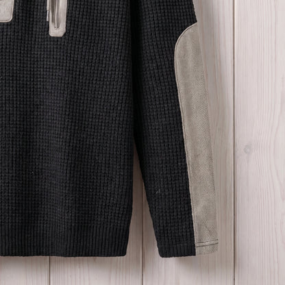Close-up of the sleeve and elbow patch on the black waffle knit hooded sweater