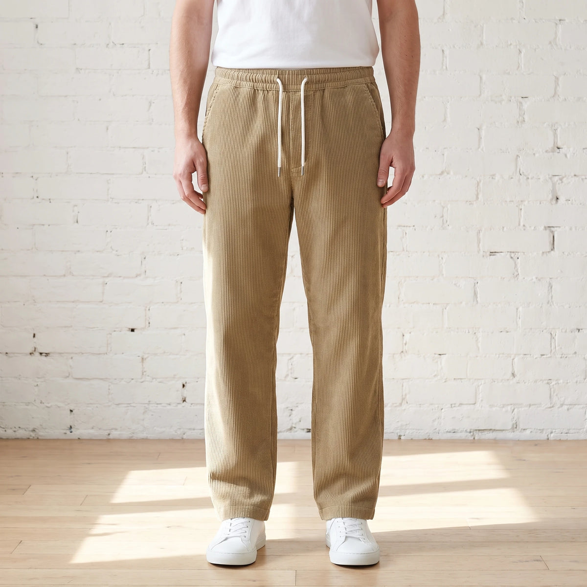 Khaki wide corduroy trousers with a white drawstring worn with a white tee and sneakers