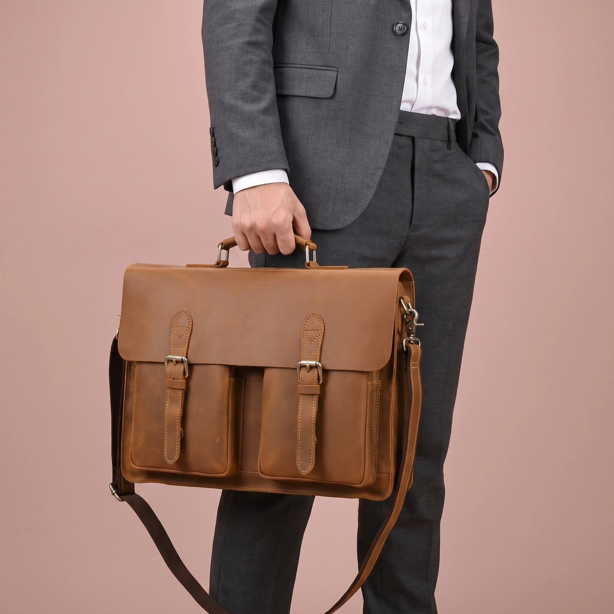 CLASSIC LEATHER BRIEFCASE carried by the handle