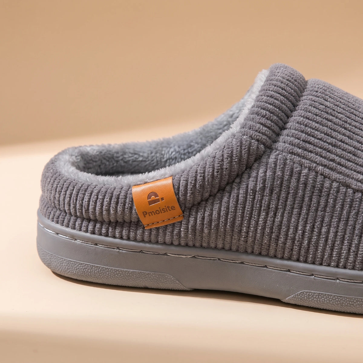 CUSHION COMFORT SLIPPERS ribbed upper and tab close-up