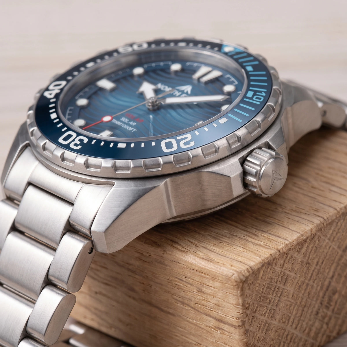 WAVE DIAL DIVER WATCH bezel, crown and case close-up