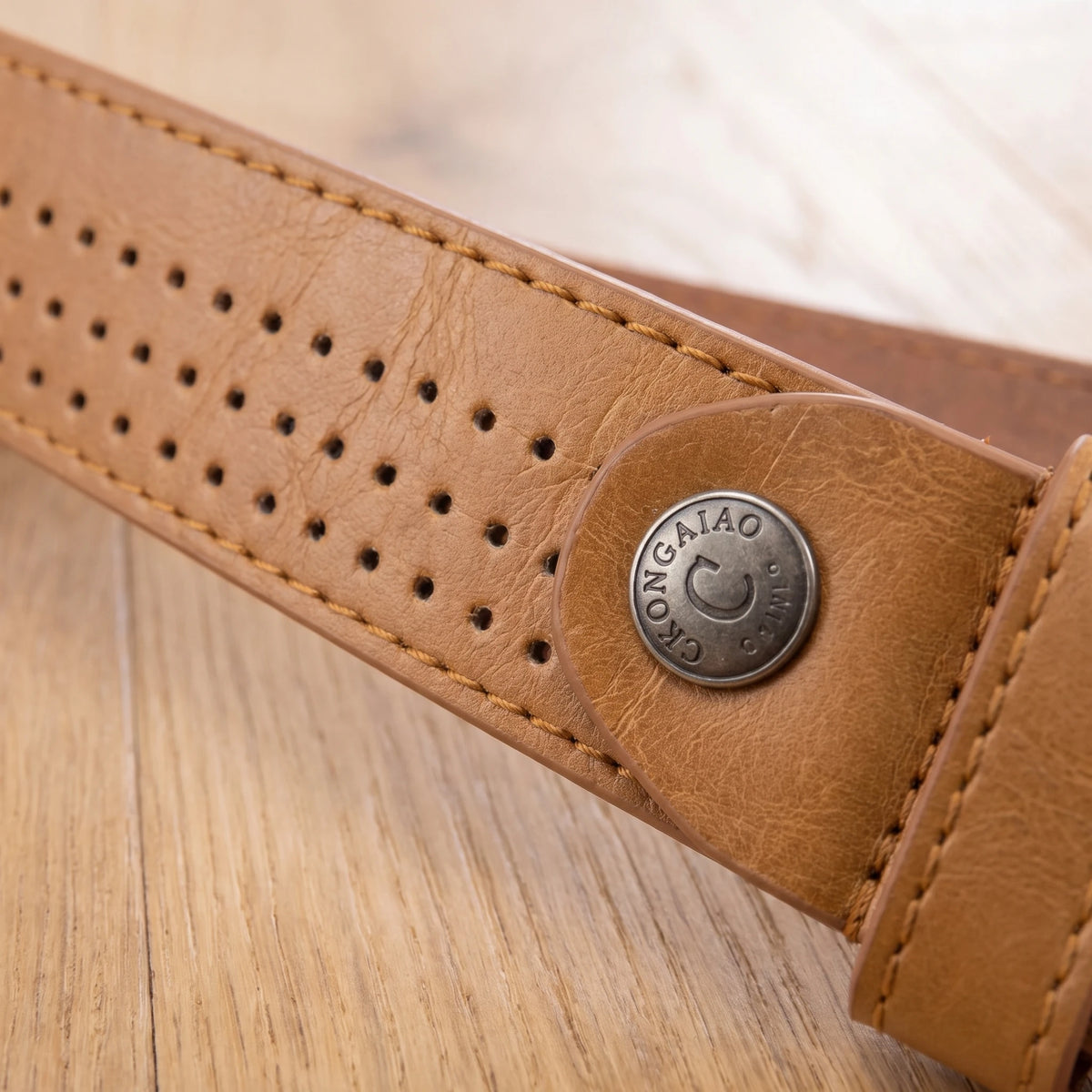 PUNCHED PIN BUCKLE BELT punched strap and rivet close-up